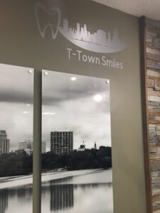 Black and white photo panels of a cityscape on a wall.