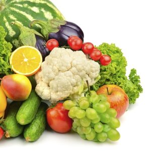 Fresh fruits and vegetables assortment, white background.
